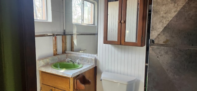 bathroom with vanity and toilet