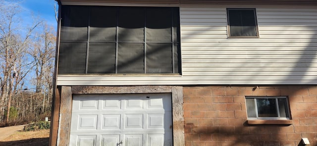 view of property exterior with a garage