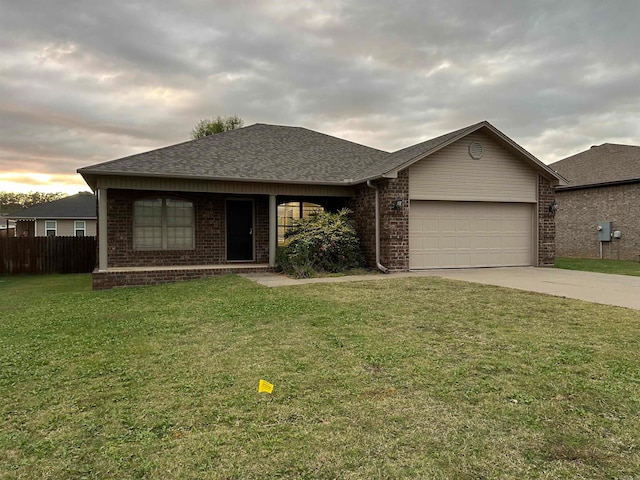 ranch-style house with a front lawn and a garage