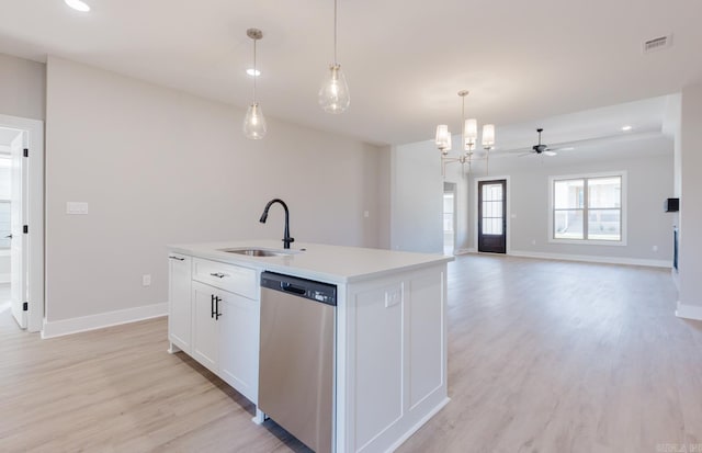 kitchen with dishwasher, sink, an island with sink, white cabinetry, and decorative light fixtures