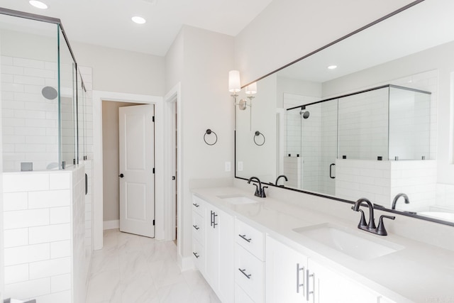 bathroom with vanity and a shower with shower door