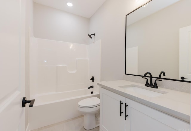 full bathroom featuring toilet, washtub / shower combination, and vanity