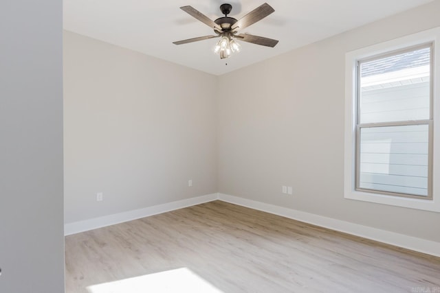 spare room with light hardwood / wood-style floors and ceiling fan