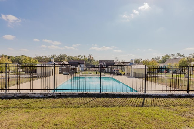 view of pool with a yard and a patio area