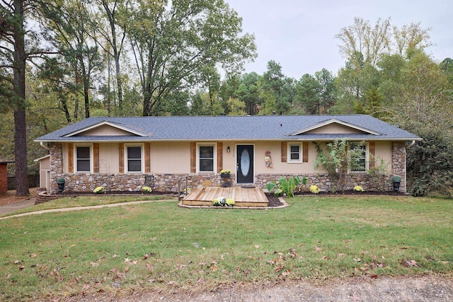 single story home featuring a front lawn