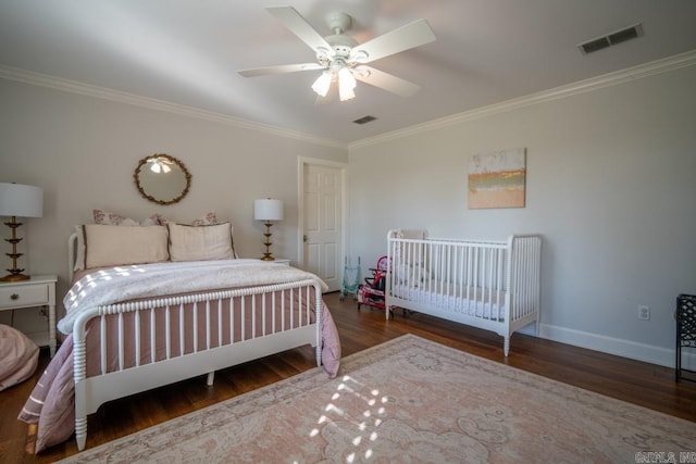 bedroom featuring ornamental molding, ceiling fan, and dark hardwood / wood-style floors