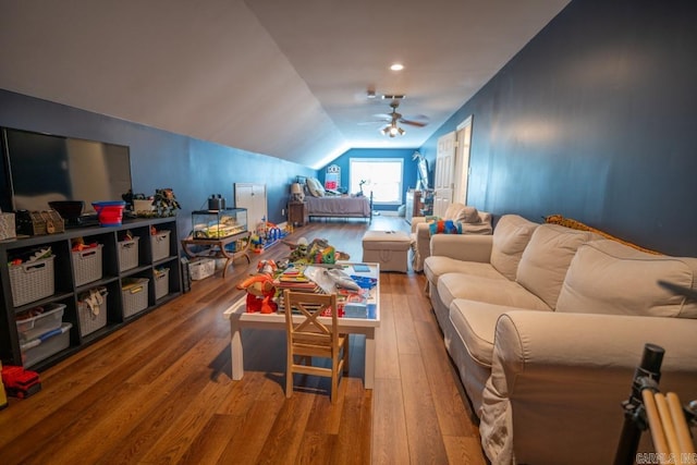 interior space featuring wood-type flooring, ceiling fan, and lofted ceiling