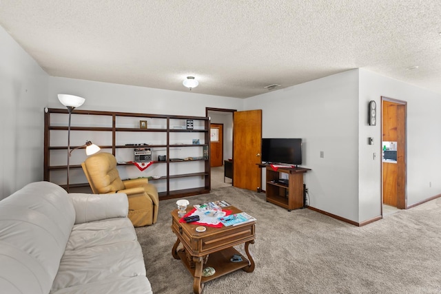 living room featuring a textured ceiling and light carpet