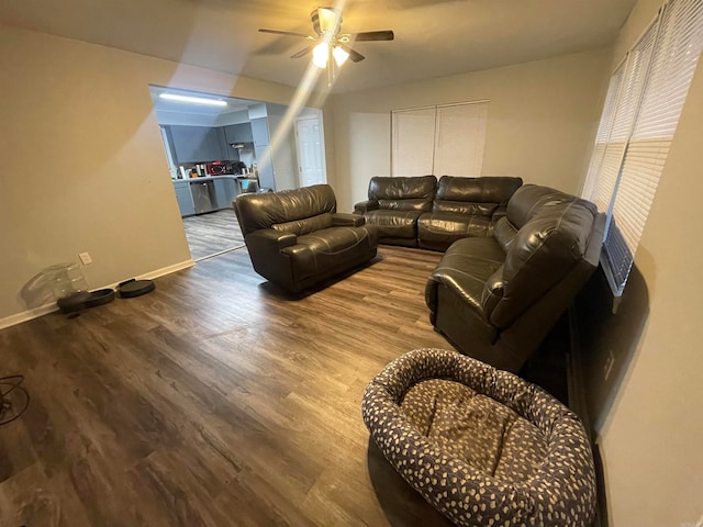 living room featuring hardwood / wood-style floors and ceiling fan