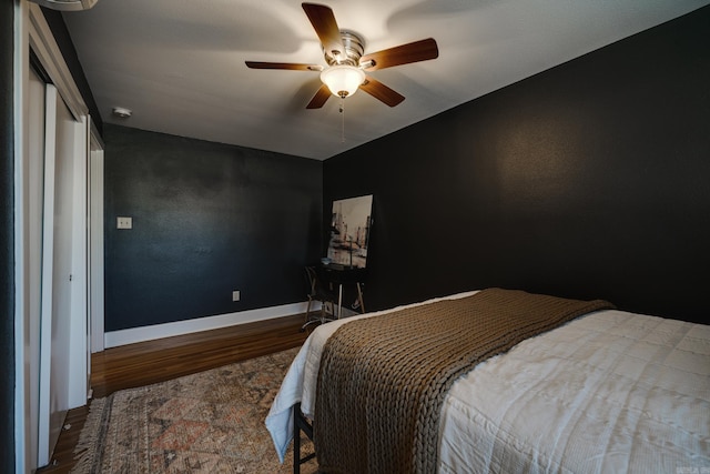 bedroom featuring hardwood / wood-style flooring and ceiling fan