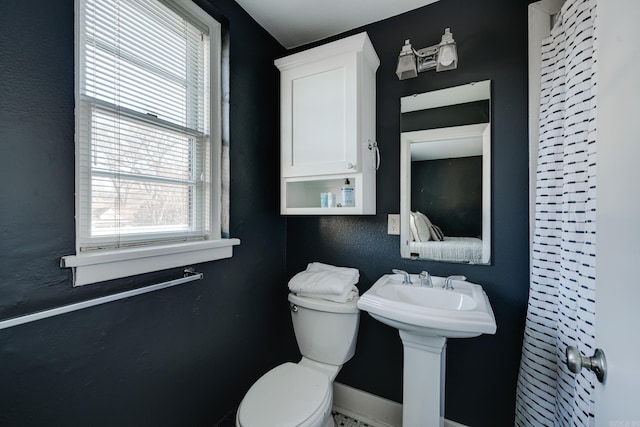 bathroom with toilet and sink