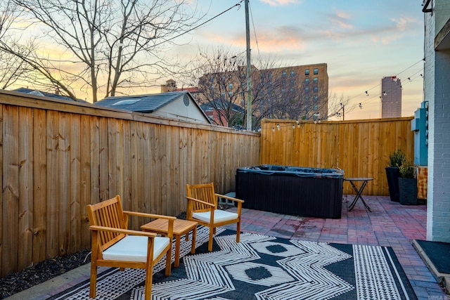 view of patio terrace at dusk