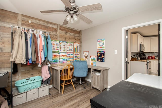 interior space with light wood-type flooring and ceiling fan