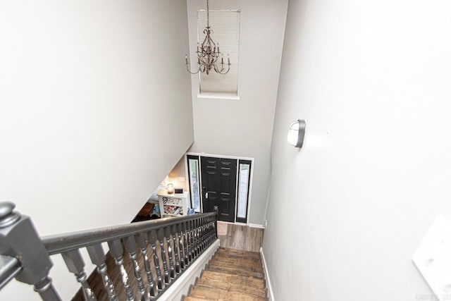 stairway featuring hardwood / wood-style floors