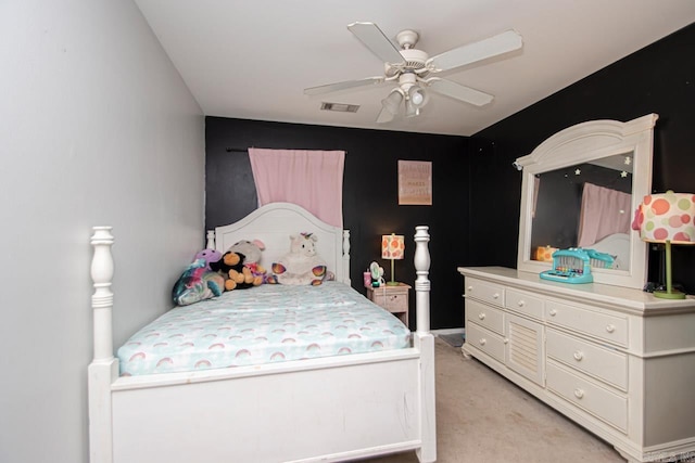 bedroom with ceiling fan and light carpet