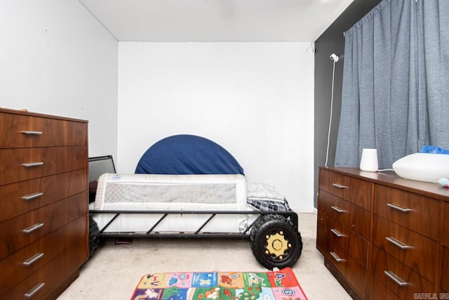 bedroom with light colored carpet