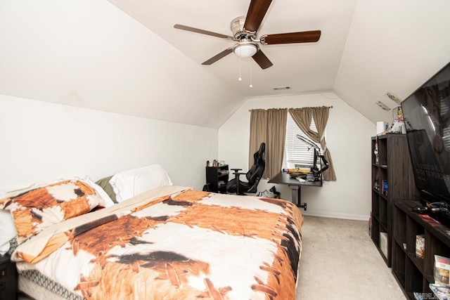 bedroom featuring lofted ceiling, light carpet, and ceiling fan