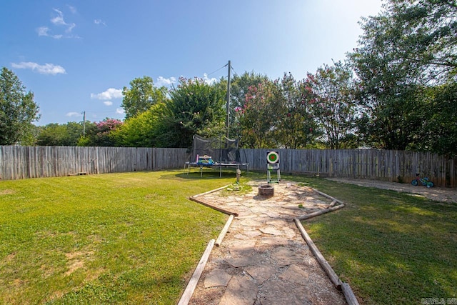 view of yard featuring a trampoline