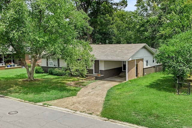 view of front of home with a front lawn and a carport