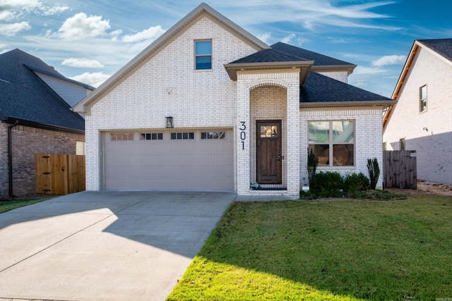 view of front facade with a front lawn and a garage