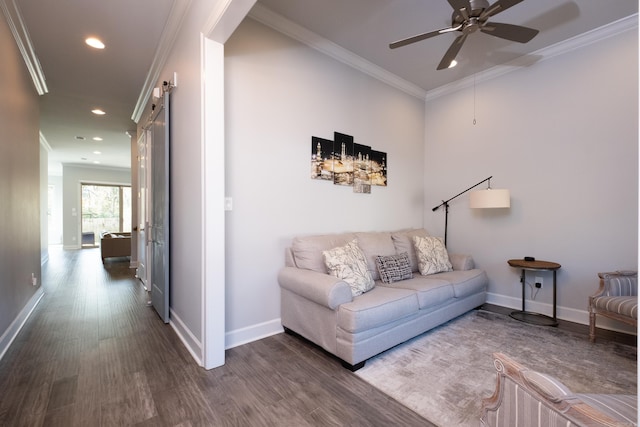 living room with ceiling fan, hardwood / wood-style floors, and ornamental molding