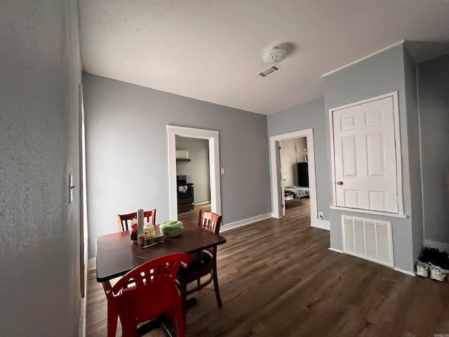 hall with dark wood-type flooring