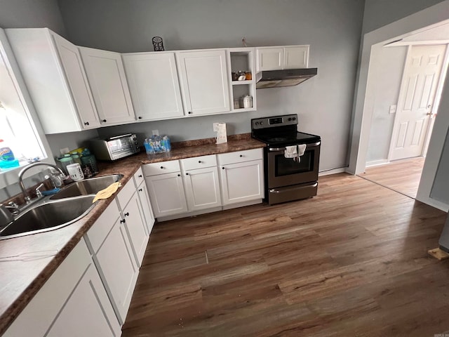 kitchen with white cabinets, sink, dark hardwood / wood-style floors, stainless steel electric stove, and range hood