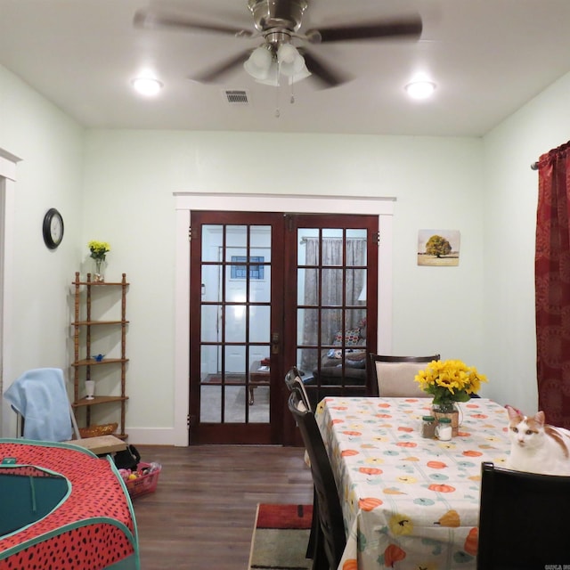 dining area with dark hardwood / wood-style flooring, french doors, and ceiling fan