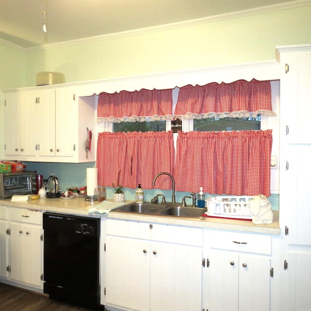 kitchen with dishwasher, white cabinetry, and sink