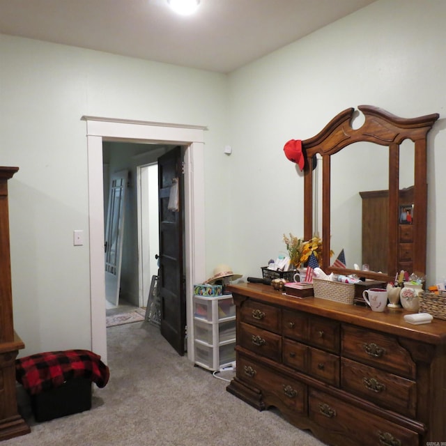 bedroom with light colored carpet