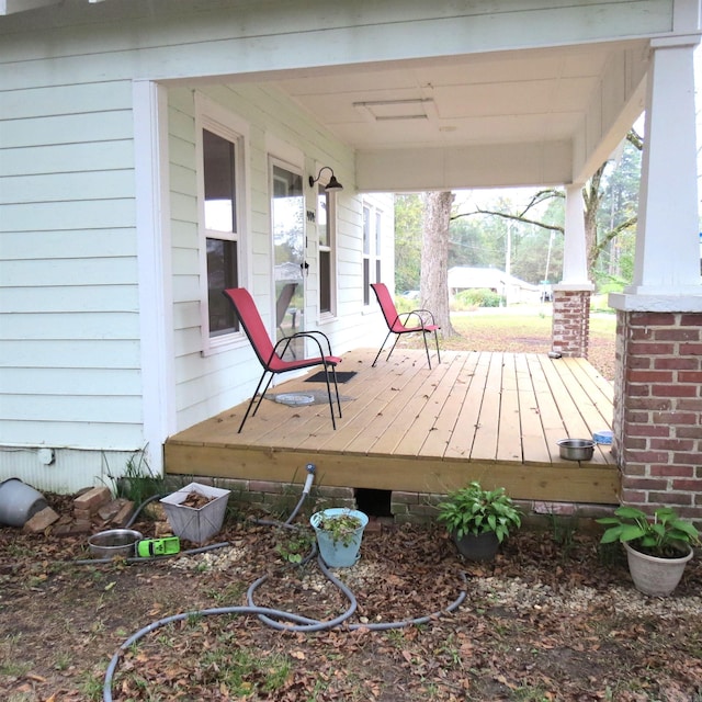 wooden deck featuring covered porch