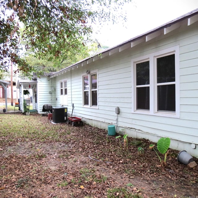 view of side of home with cooling unit