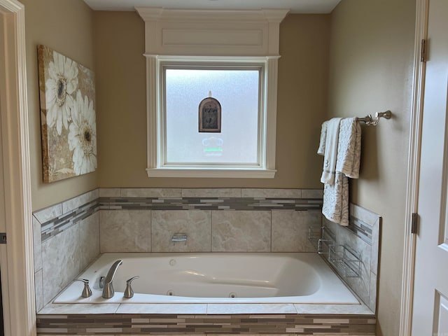 bathroom featuring tiled bath