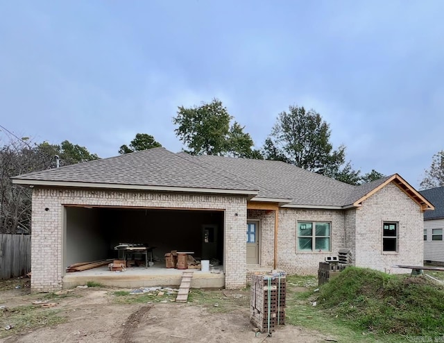 back of property with a garage