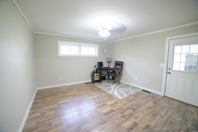 home office featuring ornamental molding, plenty of natural light, and dark wood-type flooring