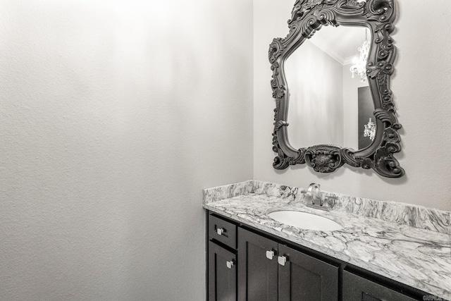 bathroom featuring vanity and crown molding