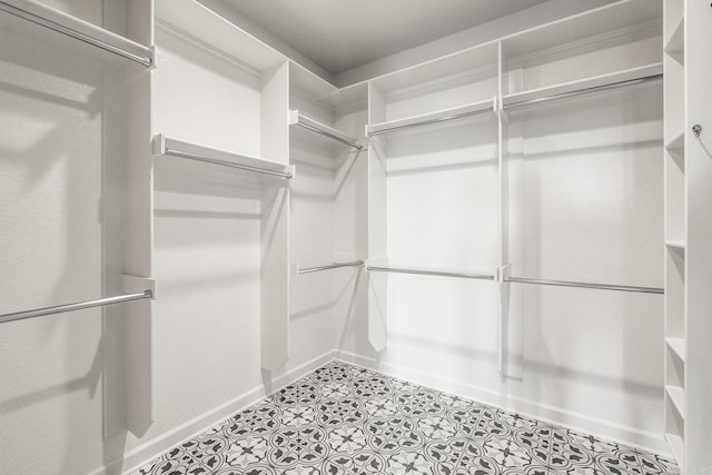 walk in closet featuring light tile patterned floors