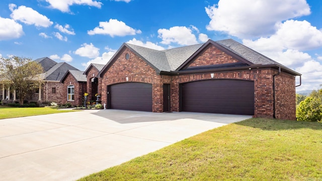 view of front facade with a garage and a front lawn