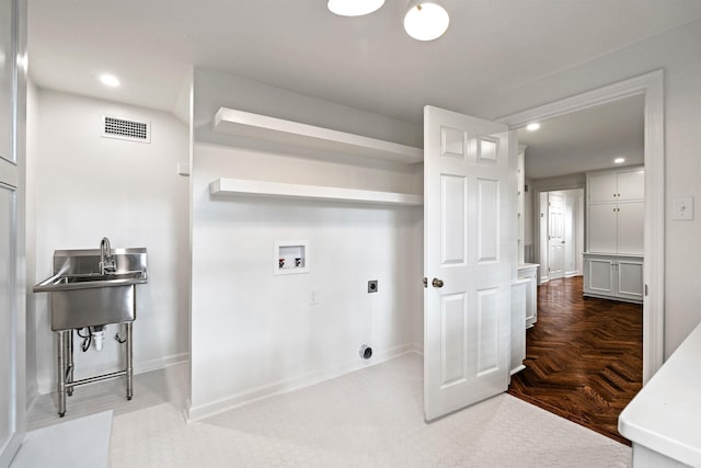 clothes washing area with washer hookup, parquet floors, and hookup for an electric dryer