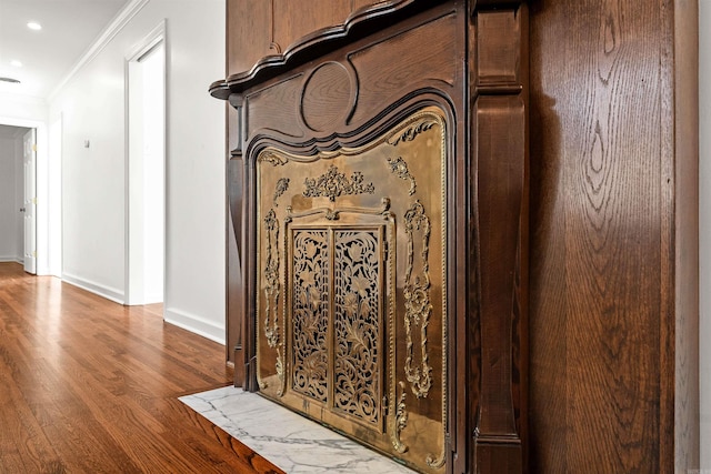 interior details featuring hardwood / wood-style floors and ornamental molding