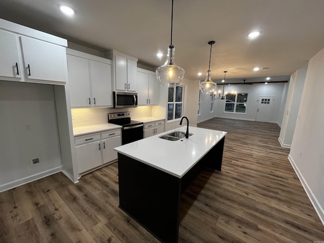 2497 Janet, Benton, AR 72015 - kitchen featuring stainless steel microwave, electric range oven, a sink, recessed lighting, and baseboards