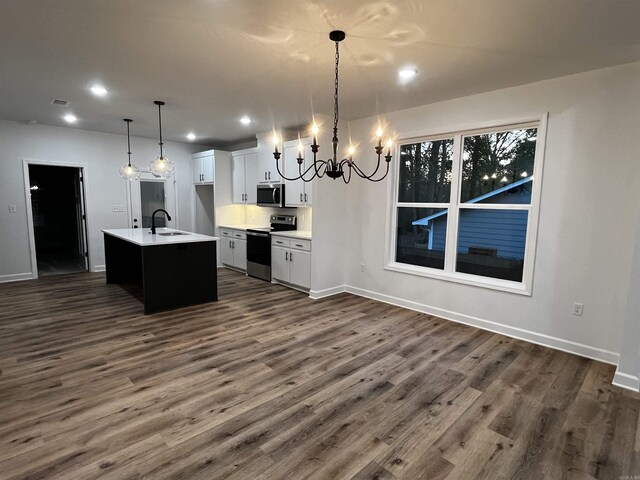 2497 Janet, Benton, AR 72015 - kitchen with appliances with stainless steel finishes, a chandelier, dark wood finished floors, baseboards, and recessed lighting