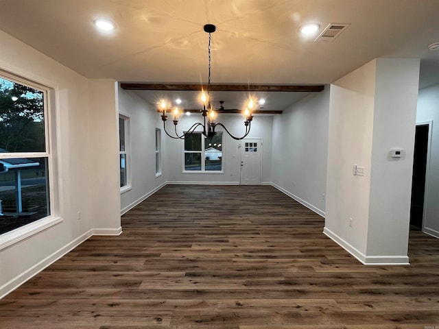 unfurnished dining area with dark hardwood / wood-style flooring and a chandelier