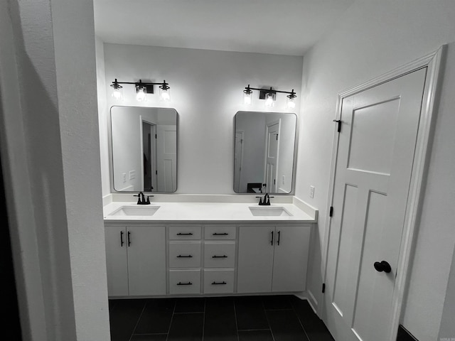 bathroom featuring tile patterned flooring and vanity