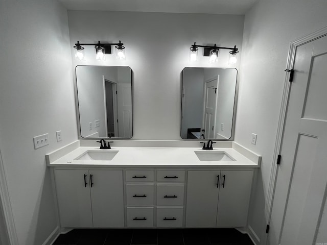 bathroom with tile patterned flooring and vanity