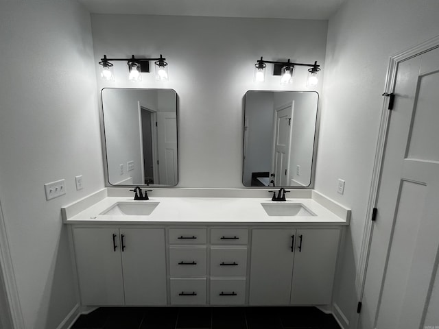 2497 Janet, Benton, AR 72015 - bathroom featuring double vanity, tile patterned flooring, and baseboards