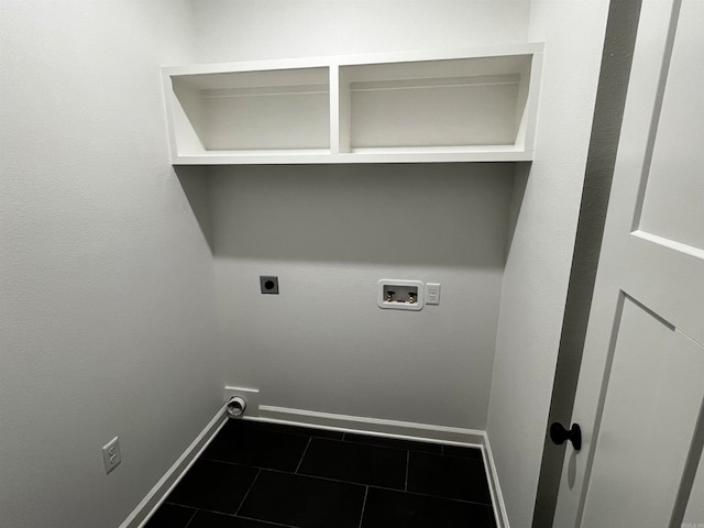 laundry room with dark tile patterned floors, hookup for a washing machine, and electric dryer hookup