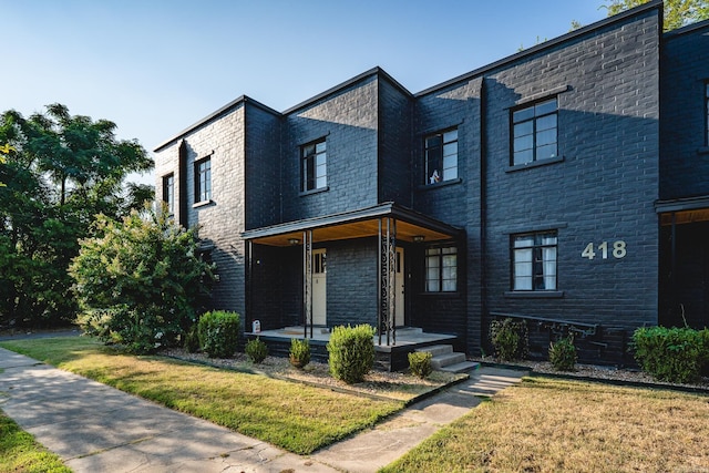 contemporary house with a front lawn