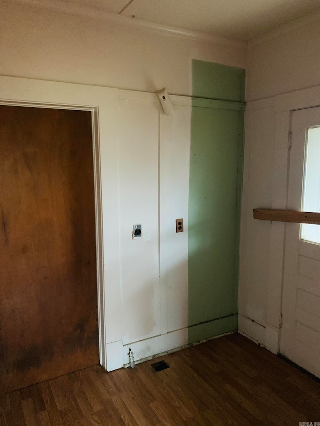 unfurnished bedroom with dark wood-type flooring