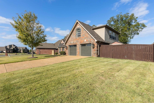 view of front of house featuring a front yard and a garage